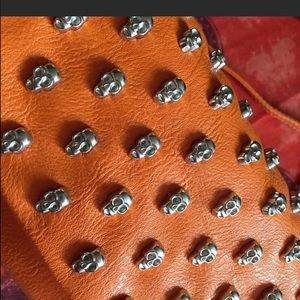 Orange skull studded bag